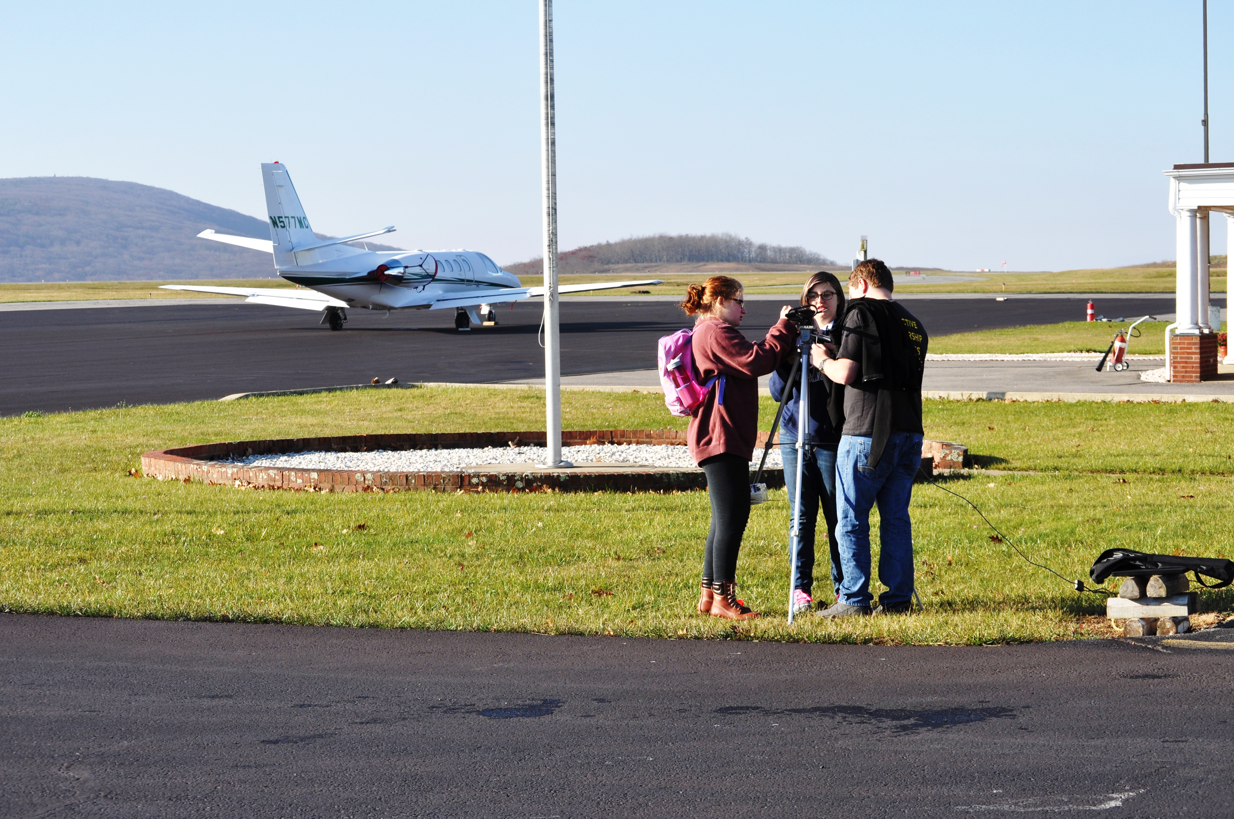 Jessica and Lauren working with a male classmate.